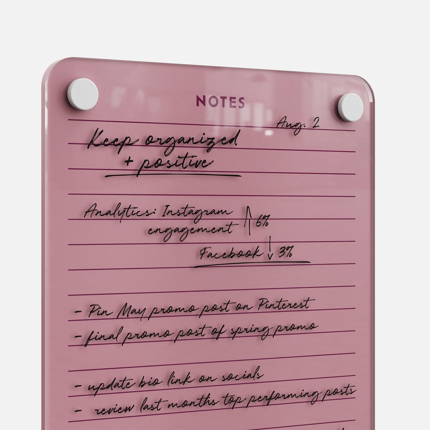Stay organized and positive with Lined Notes 69, a pink glass dry-erase board for handwritten lists, tracking Instagram and Facebook analytics, posting promos, updating your social bio link, and reviewing top posts.
