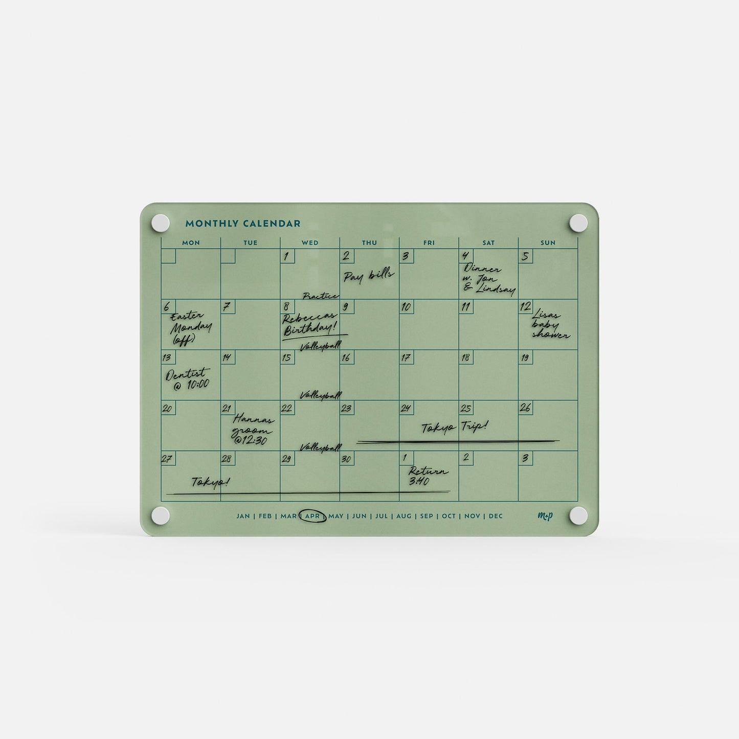 The Monthly Calendar 118 is a green, reusable planner with handwritten events on most days. This compact calendar has days of the week labeled at the top, months along the bottom, and four corner holes for easy mounting.