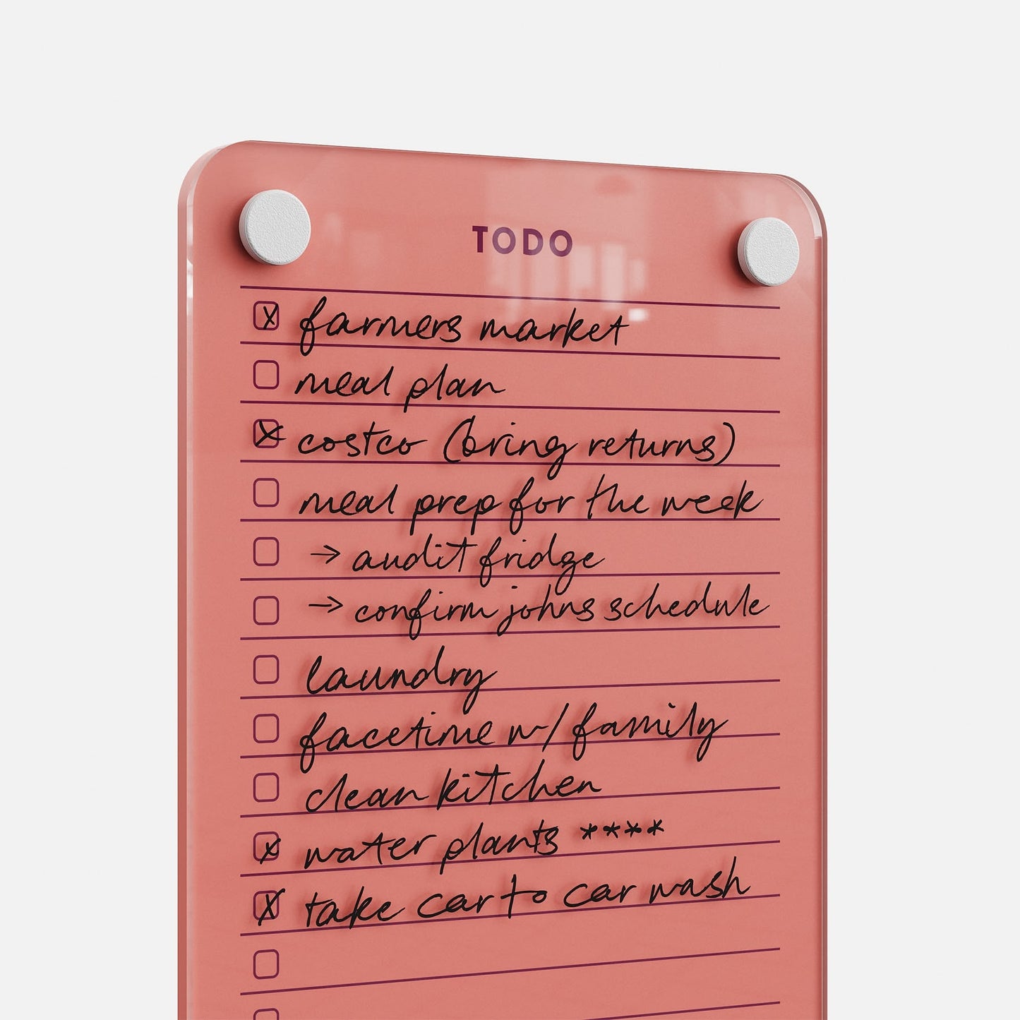 Todo List 59 is a pink magnetic to-do board with handwritten tasks for easy management, like: farmers market, meal plan, coasters, meal prep, confirm John’s schedule, laundry, Facetime with family, clean kitchen, water plants, and car wash.
