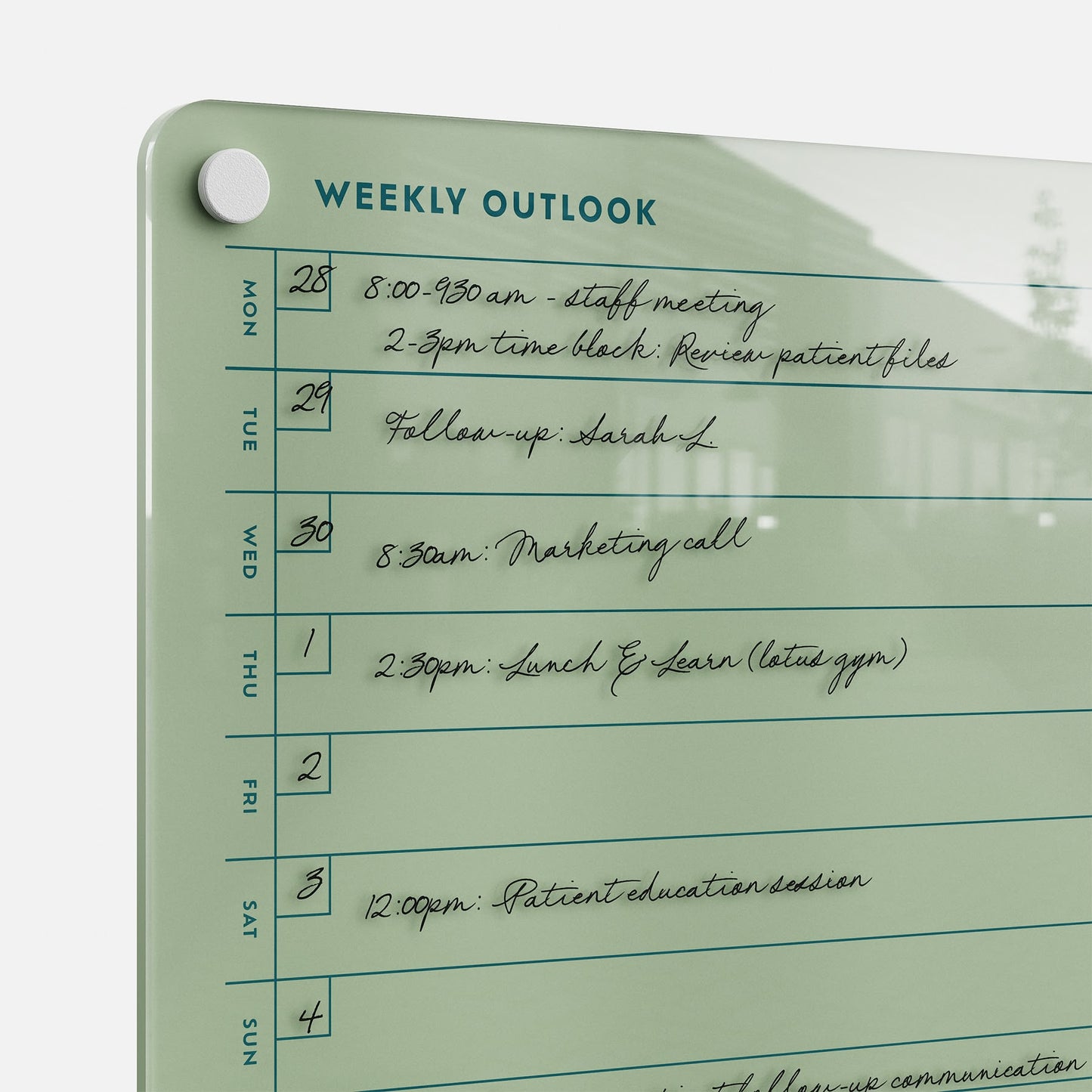 The Weekly Outlook 811 glass dry-erase board serves as a stylish wall-mounted weekly planner, displaying your meeting notes and reminders. It includes a magnetic white marker holder in the top left—perfect for organizing your schedule.