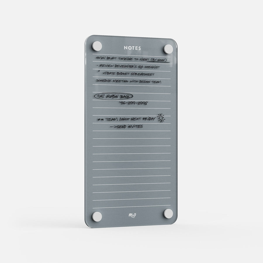 The Lined Notes 59 is a gray magnetic board with rounded corners and "NOTES" at the top. It features lined sections for tasks, meetings, and phone numbers, space for doodles, and includes four circular magnets in each corner.