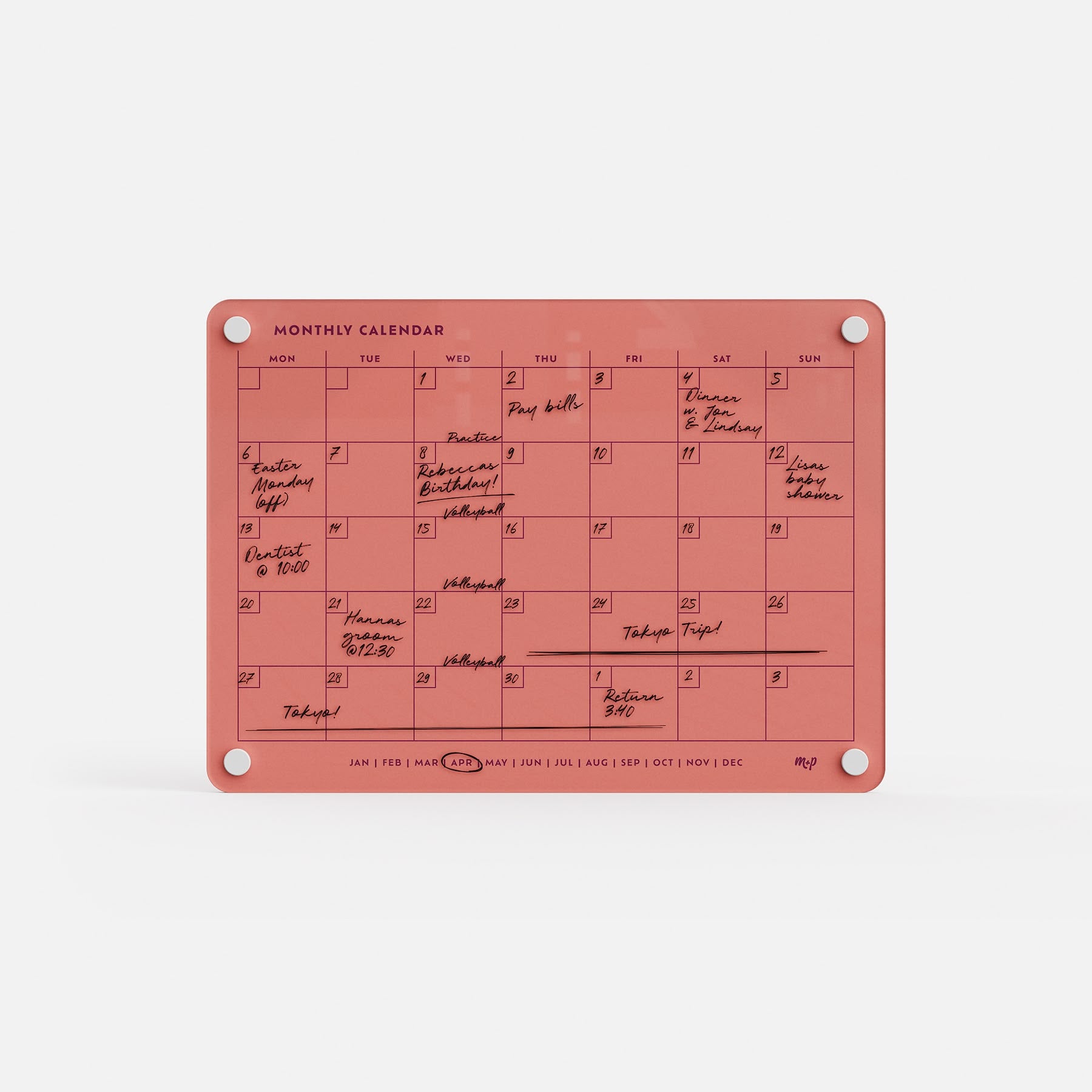 The Monthly Calendar 118 is a red compact calendar featuring handwritten notes and black ink events. It’s mounted with four metal-rimmed corner holes and displays abbreviated months at the bottom.