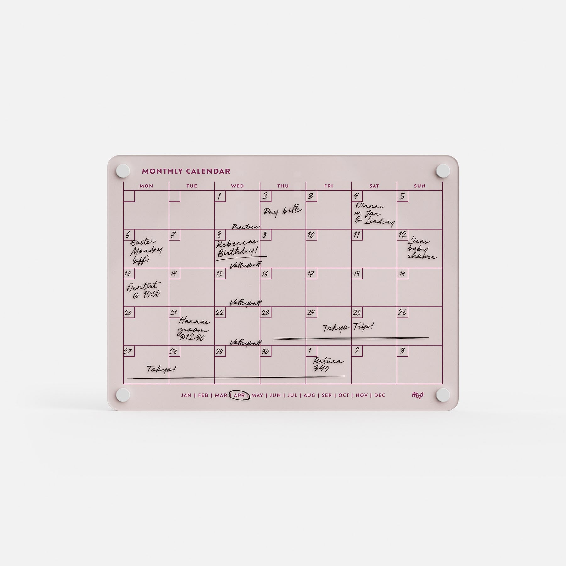 Monkey and Pebbles’ premium acrylic monthly calendar is a pink, erasable, reusable planner with white magnets and months below.