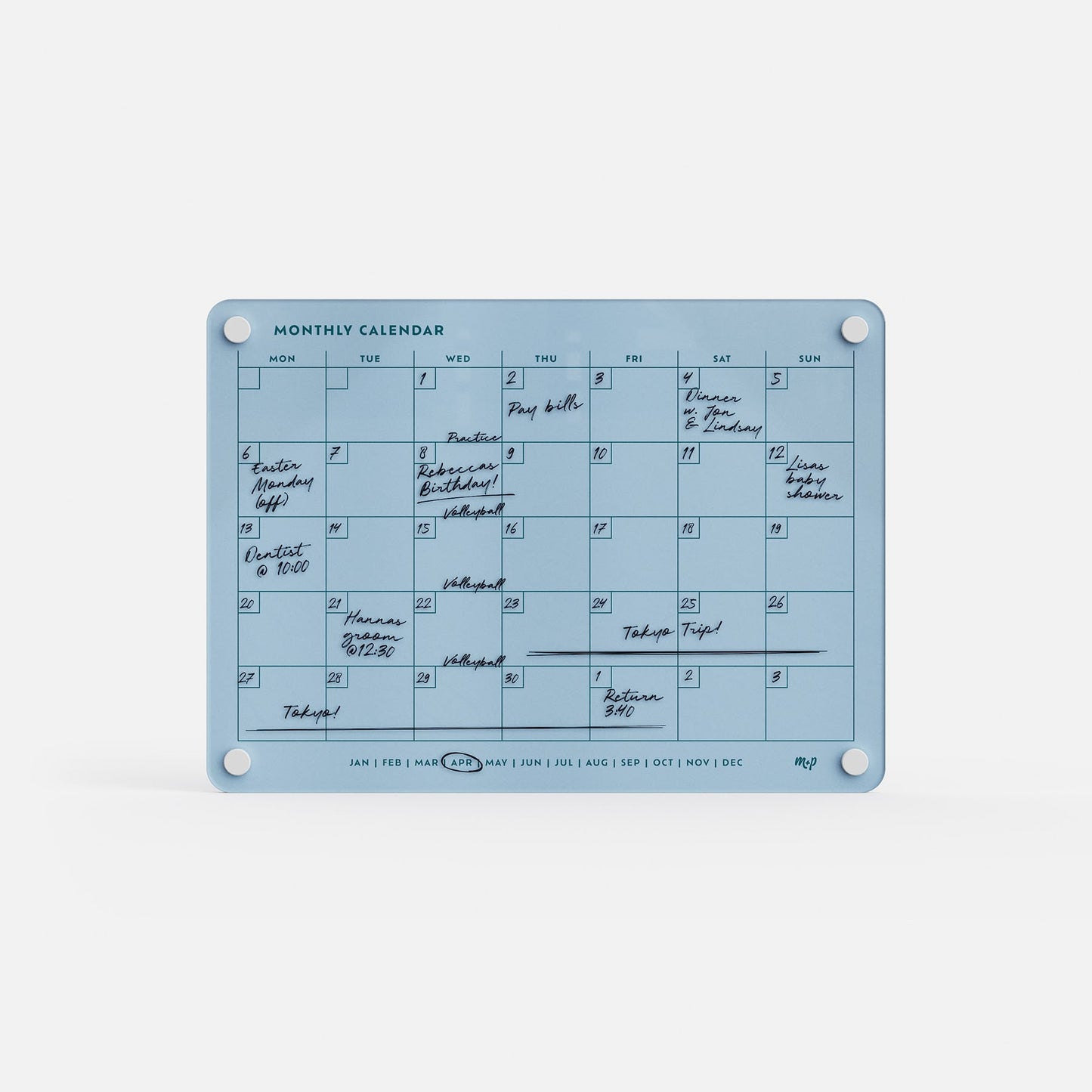 The Monthly Calendar 118 is a blue compact dry-erase planner and family organizer with white corners, handwritten black marker notes on several days, and clearly labeled days of the week and months at the top and bottom.