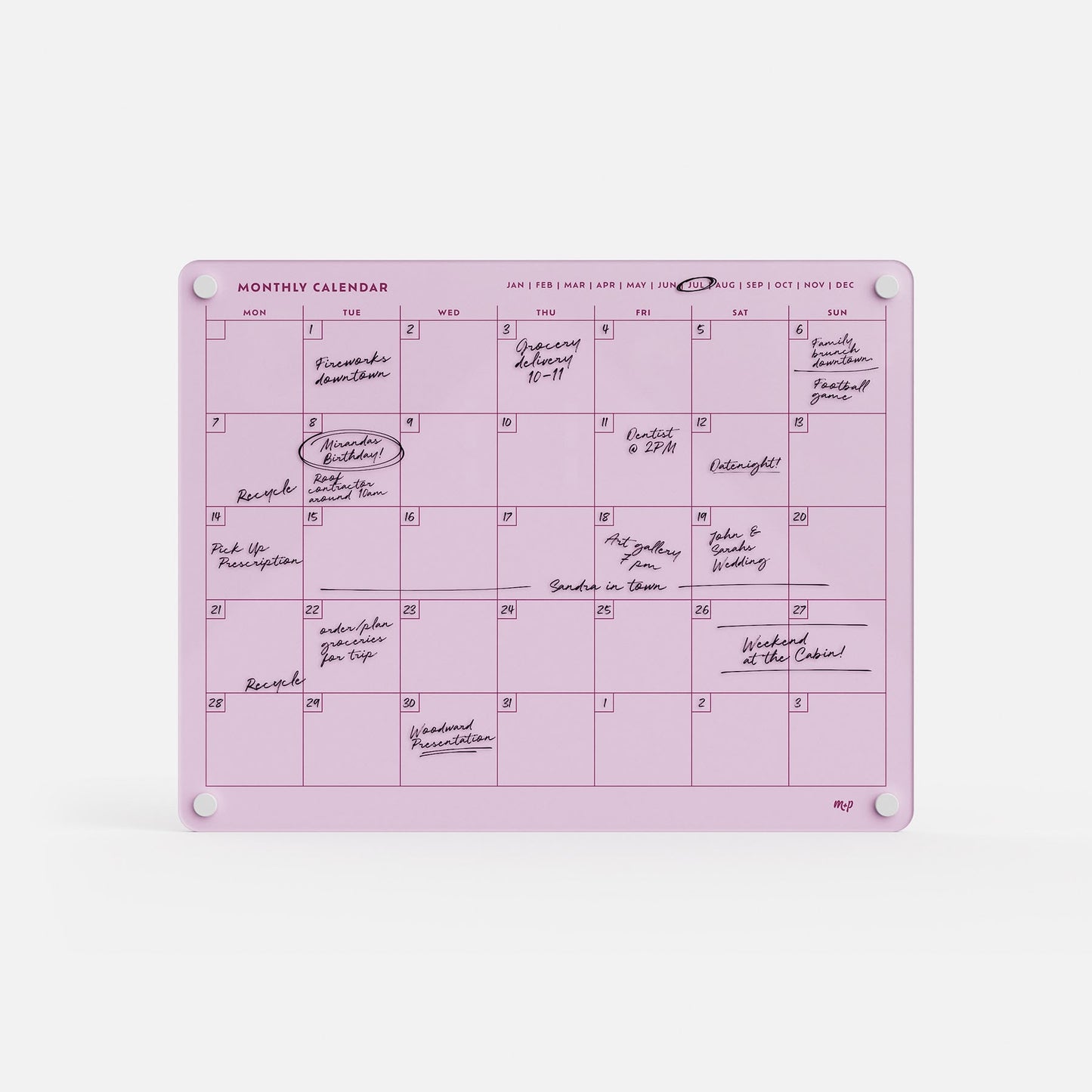 Premium acrylic monthly calendar board in pink for erasable, reusable planning; secured by four white magnets on a white background.