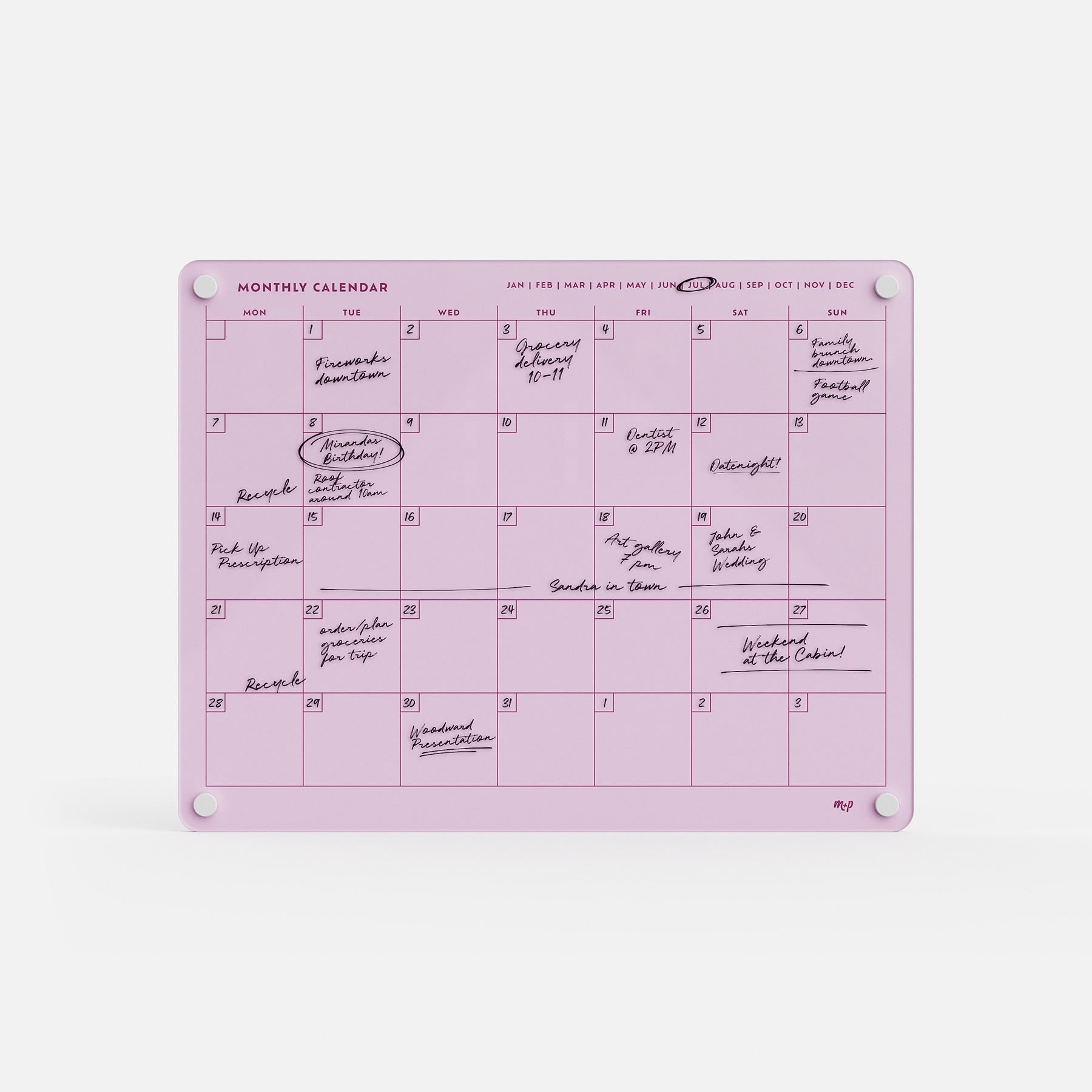 Premium acrylic monthly calendar board in pink for erasable, reusable planning; secured by four white magnets on a white background.