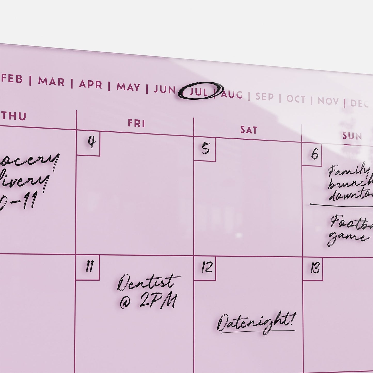 The premium acrylic Monkey and Pebbles Monthly Calendar 1411 in pink, erasable and reusable, tracks key July plans at a glance.