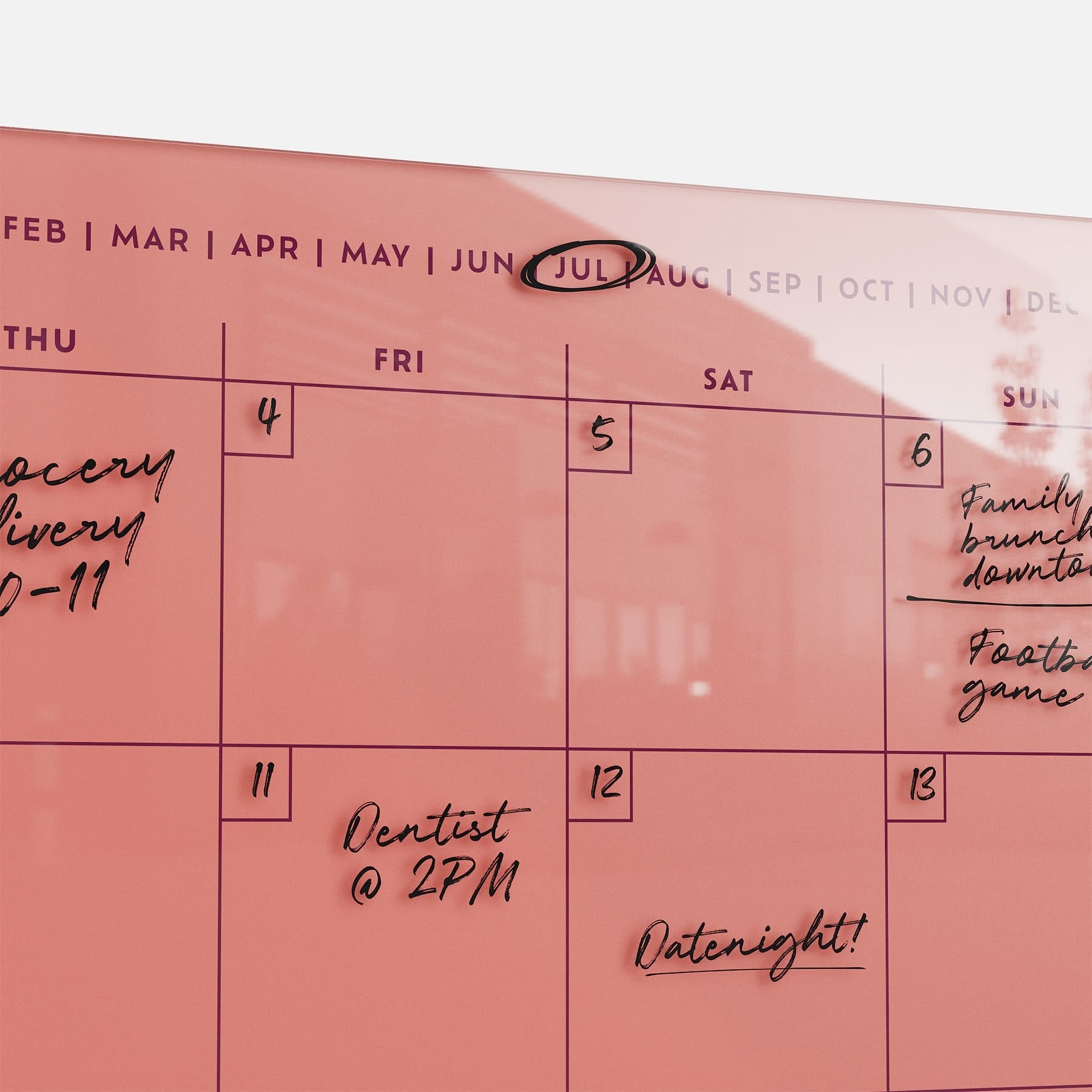 The premium acrylic Monkey and Pebbles Monthly Calendar 1411, in pink, is erasable, reusable, and organizes July plans efficiently.