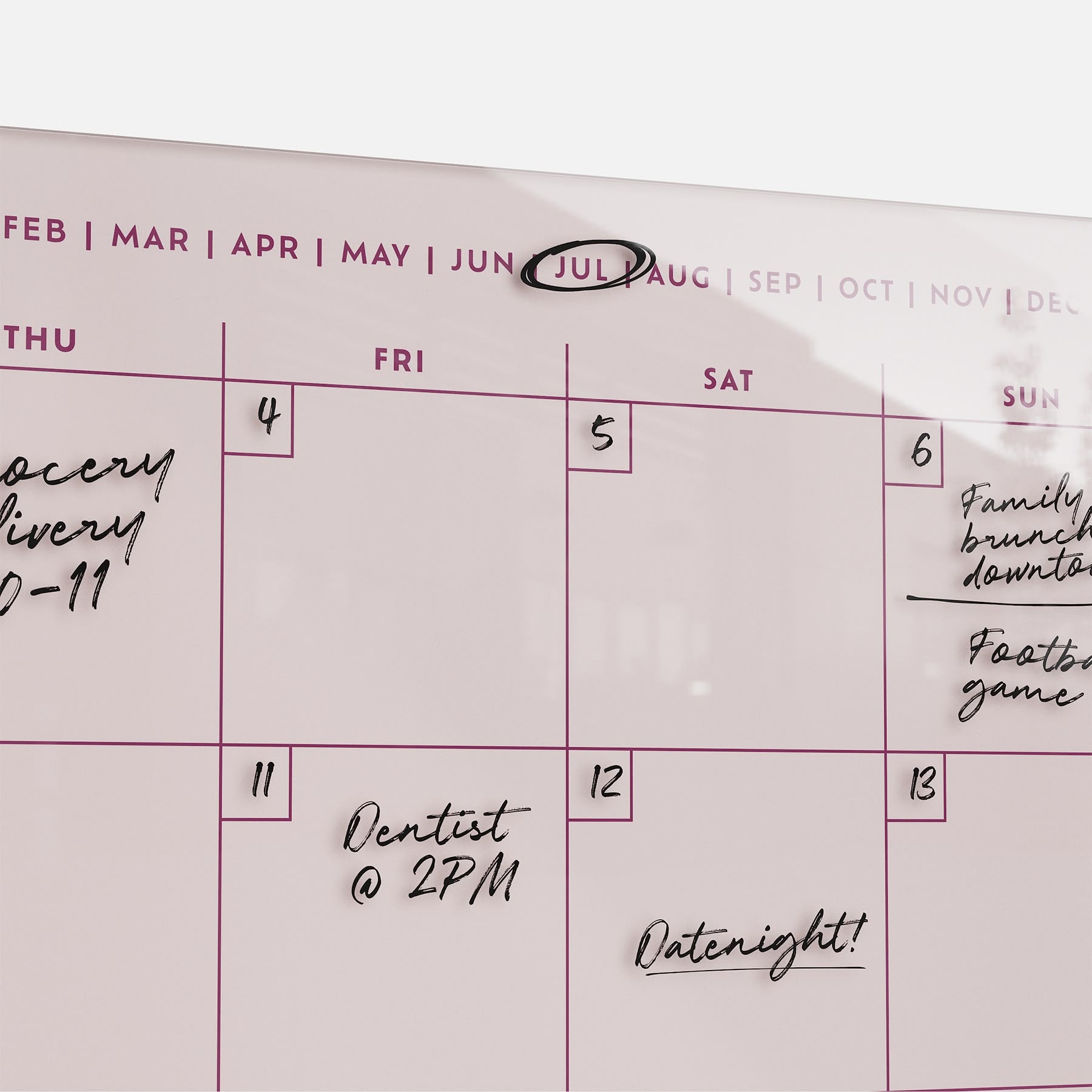 The Monthly Calendar 1411 displays July with handwritten notes: "Grocery delivery 10-11" on the 4th, "Dentist @ 2PM" on the 11th, and "Date night!" on the 12th. July is circled—ideal for family planning and organizing events.