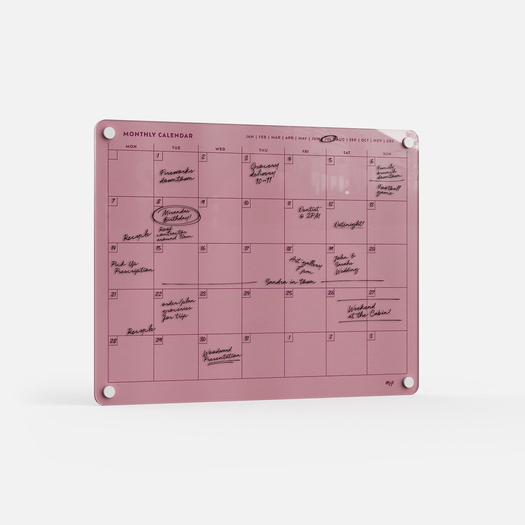 Premium acrylic monthly planner board in pink, erasable and reusable, with four corner holes, black handwriting, and circled dates.