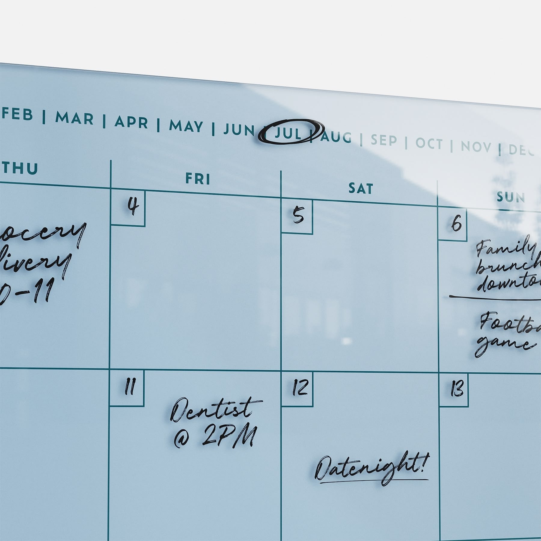 The Monkey and Pebbles premium acrylic monthly calendar 1411 features erasable, reusable notes for July like Grocery Delivery, Dentist @ 2PM, and Family Brunch—keeping your family organized.