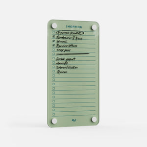 Shopping List 59 is a green magnetic kitchen board with checkboxes and handwritten items like veggies, blueberries, spinach, salmon/chicken, and Greek yogurt—great for meal planning. Some groceries are already checked off after a market run.