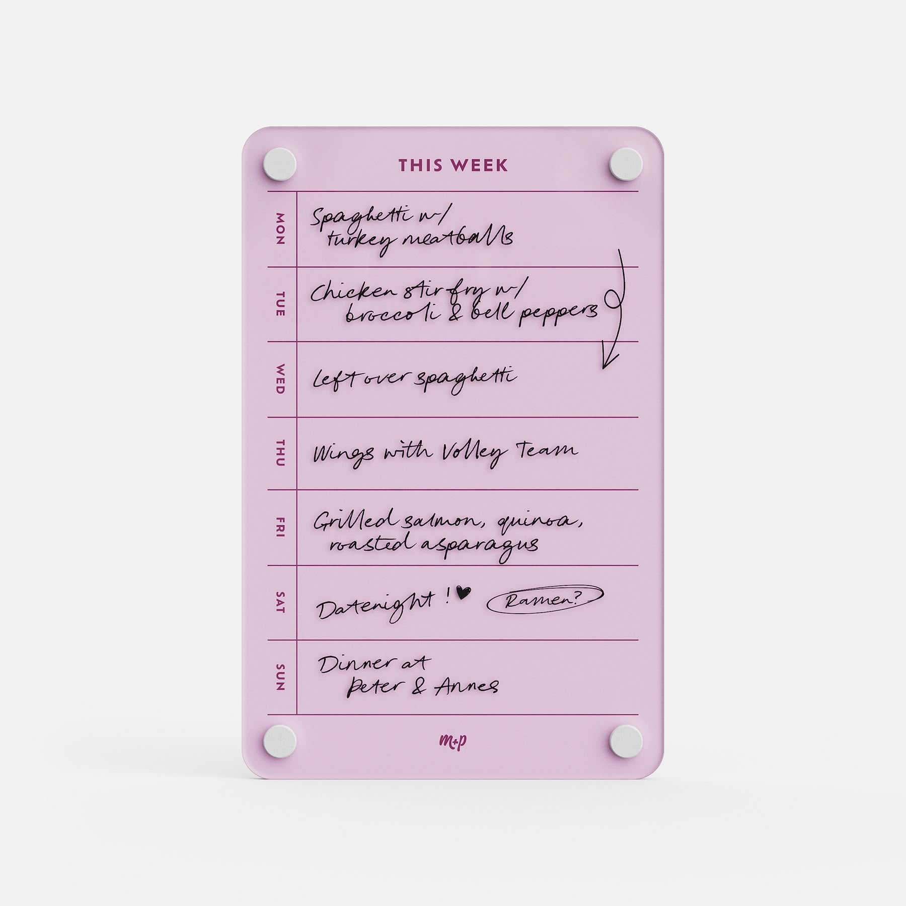 The This Week 69 organizer in pink displays handwritten meals: spaghetti with turkey meatballs, chicken stir fry, leftover spaghetti, wings with the volleyball team, grilled salmon and quinoa, date night, and dinner at Anne’s.