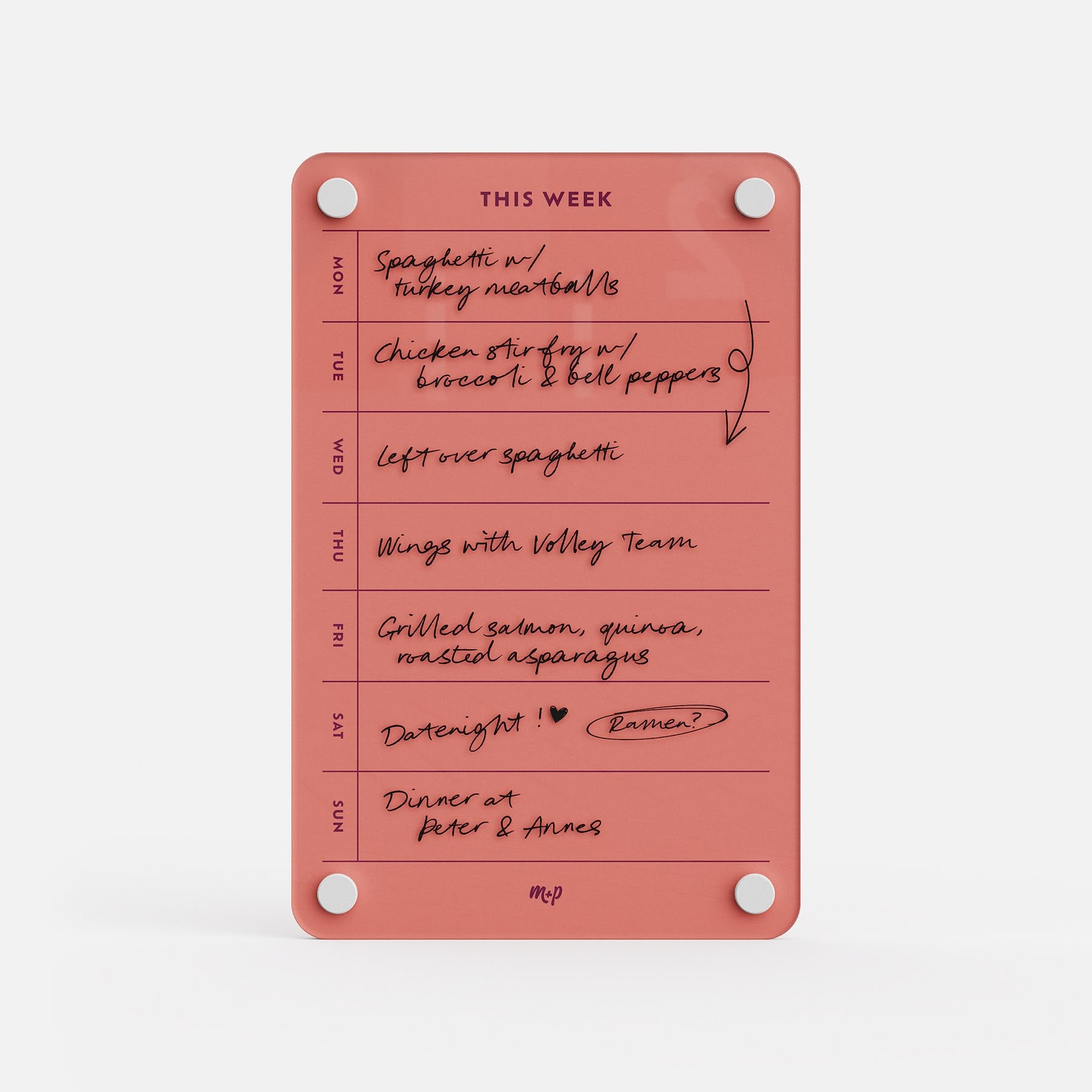 This Week 69 is a pink magnetic meal planner and weekly organizer with handwritten notes for spaghetti, chicken stir-fry, wings, grilled salmon, and a dinner date for each day.