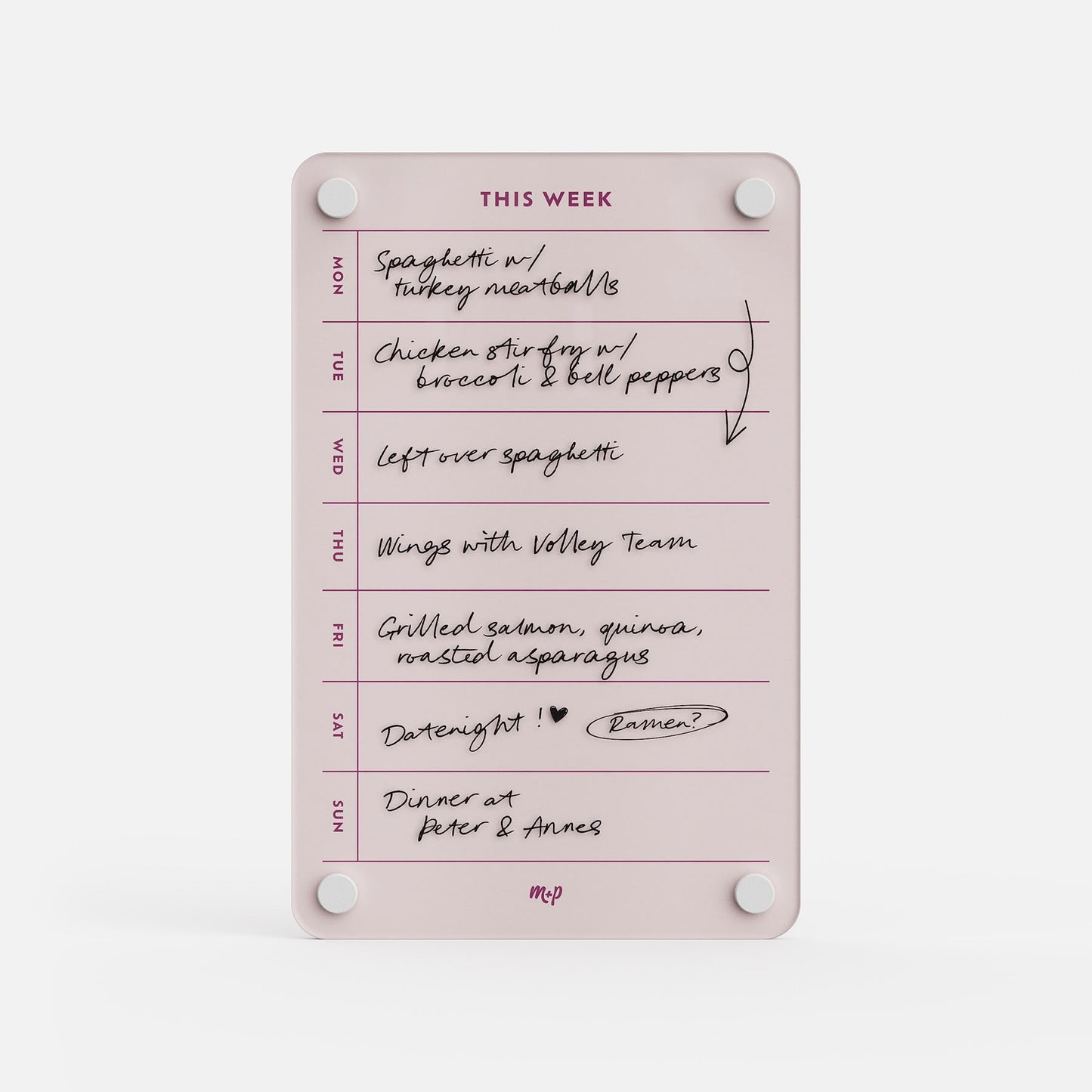 The "This Week 69" pink weekly organizer meal planner lists handwritten meals: Spaghetti with turkey meatballs, chicken stir fry with broccoli and peppers, leftovers, wings with volley team, grilled salmon, date night, and dinner at Peter & Anne’s.