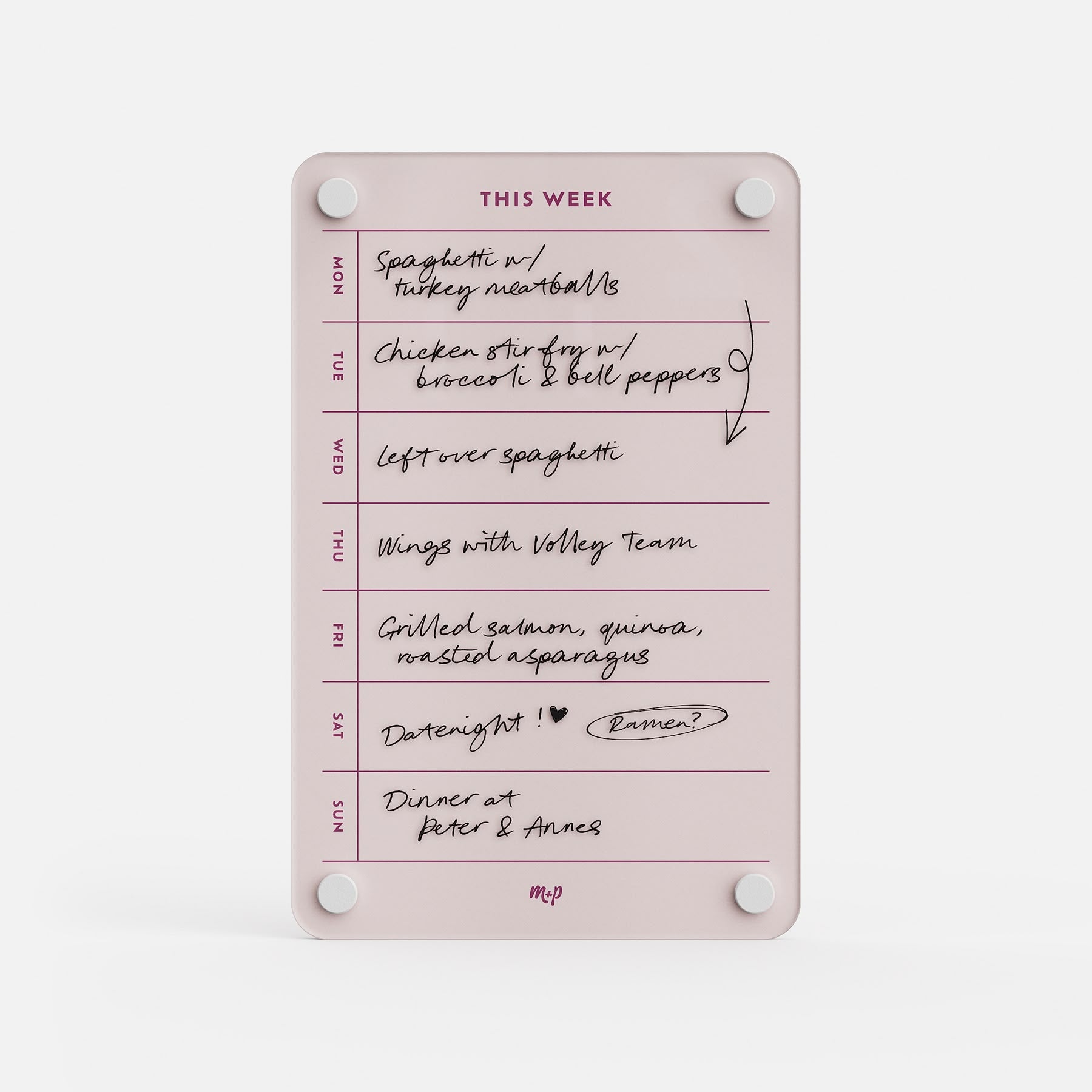 The "This Week 69" pink weekly organizer meal planner lists handwritten meals: Spaghetti with turkey meatballs, chicken stir fry with broccoli and peppers, leftovers, wings with volley team, grilled salmon, date night, and dinner at Peter & Anne’s.