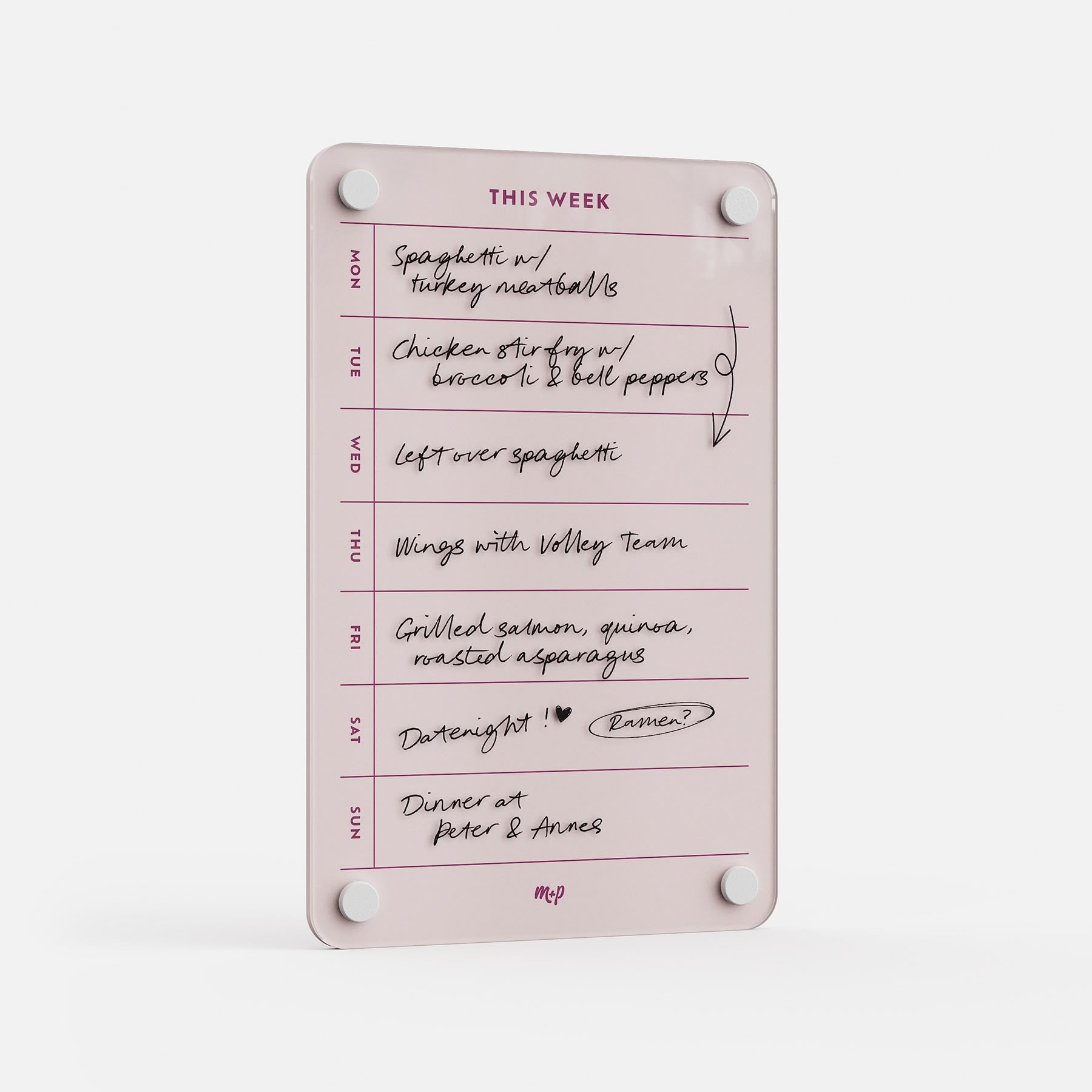 The "This Week 69" is a pink acrylic meal planner displaying handwritten weekly meals—spaghetti with turkey meatballs, chicken stir fry, wings, grilled salmon, dinner out, and date night—vertically with labeled days for easy organization.
