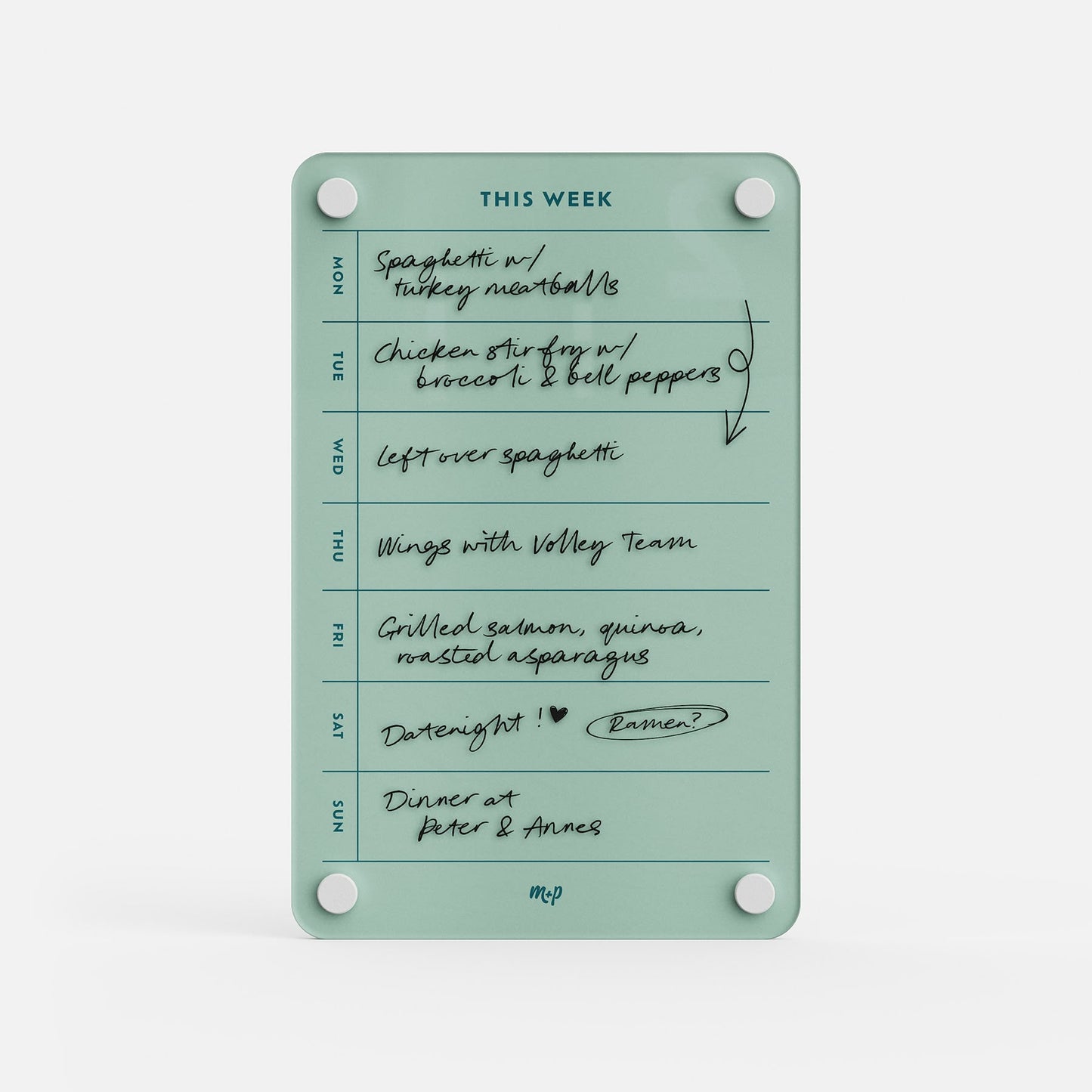 The This Week 69 organizer in teal features handwritten plans—spaghetti, chicken stir fry, wings, grilled salmon, date night dinner, and dinner at Peter & Anne’s—secured on the fridge with four white magnets.