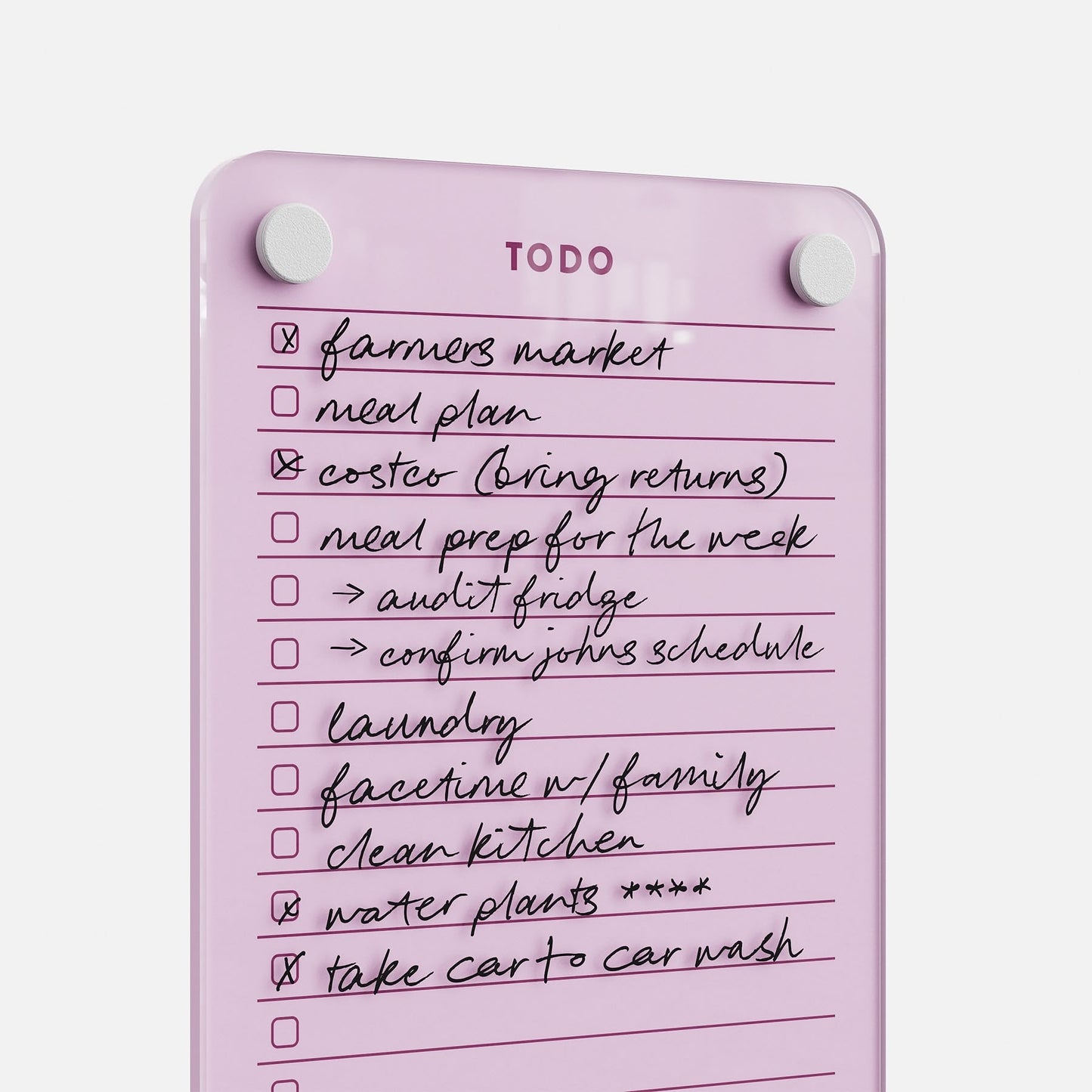 Todo List 59 is a pink glass to-do board with handwritten tasks—farmers market, meal plan, laundry, water plants, car wash—some checked off. Two round magnets at the top make this stylish daily organizer ideal for tasks.