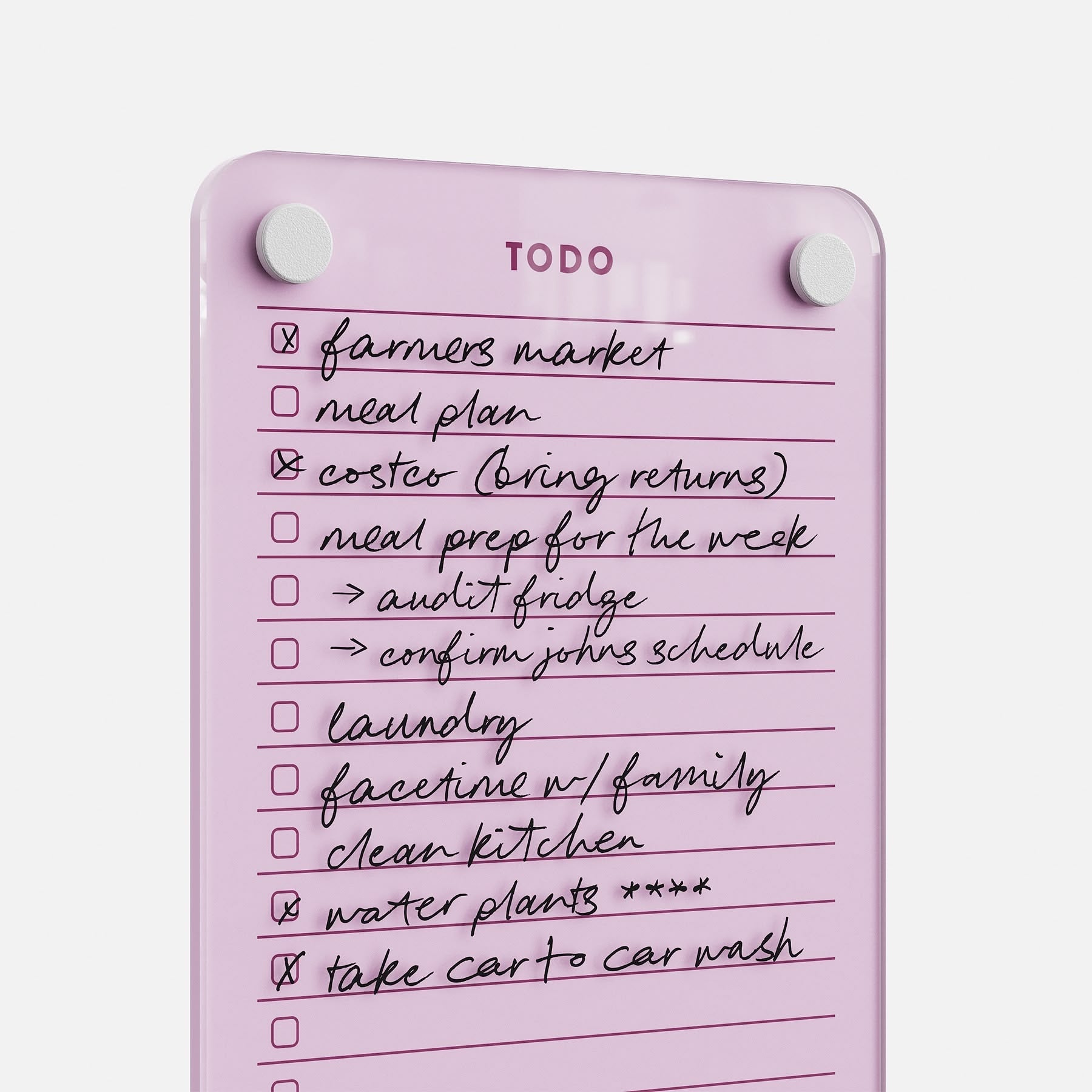 Todo List 59 is a pink glass to-do board with handwritten tasks—farmers market, meal plan, laundry, water plants, car wash—some checked off. Two round magnets at the top make this stylish daily organizer ideal for tasks.