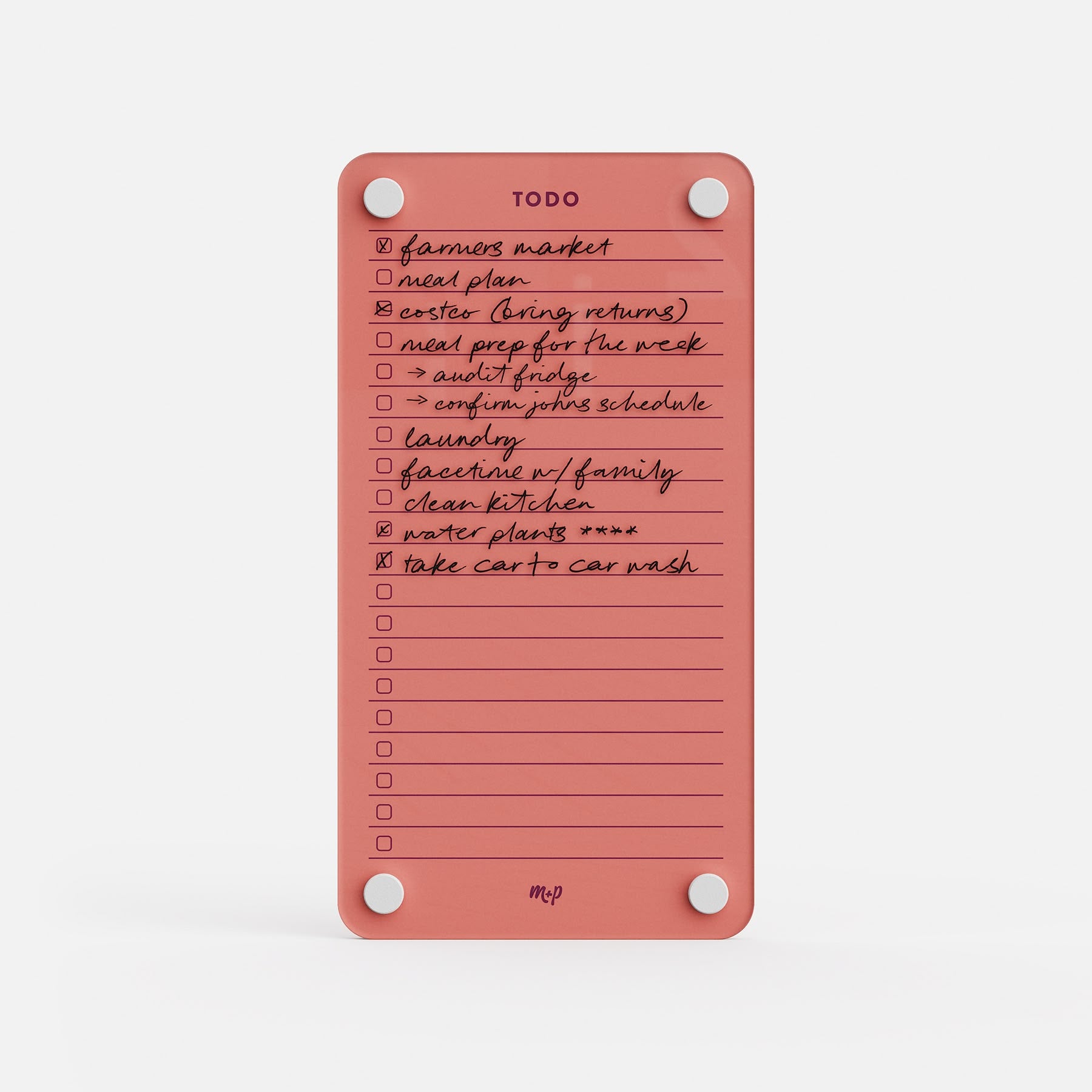 Todo List 59 is a pink daily organizer featuring handwritten tasks like farmers market, meal plan, laundry, clean kitchen, water plants, and car wash. Some items are checked off. It’s held in place with white round magnets at each corner.