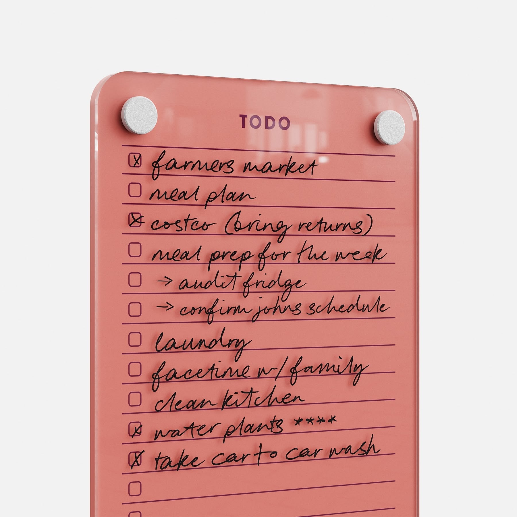Todo List 59 is a pink magnetic to-do board with handwritten tasks for easy management, like: farmers market, meal plan, coasters, meal prep, confirm John’s schedule, laundry, Facetime with family, clean kitchen, water plants, and car wash.