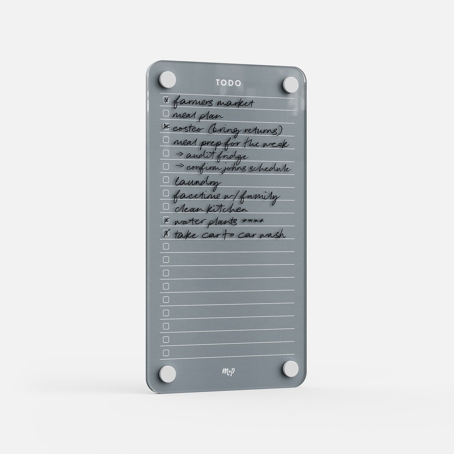 Todo List 59 is a clear acrylic board for handwritten tasks like "farmers market" and "water plants." With four corner holes and an mcp logo, this sleek organizer adds style to daily task management.
