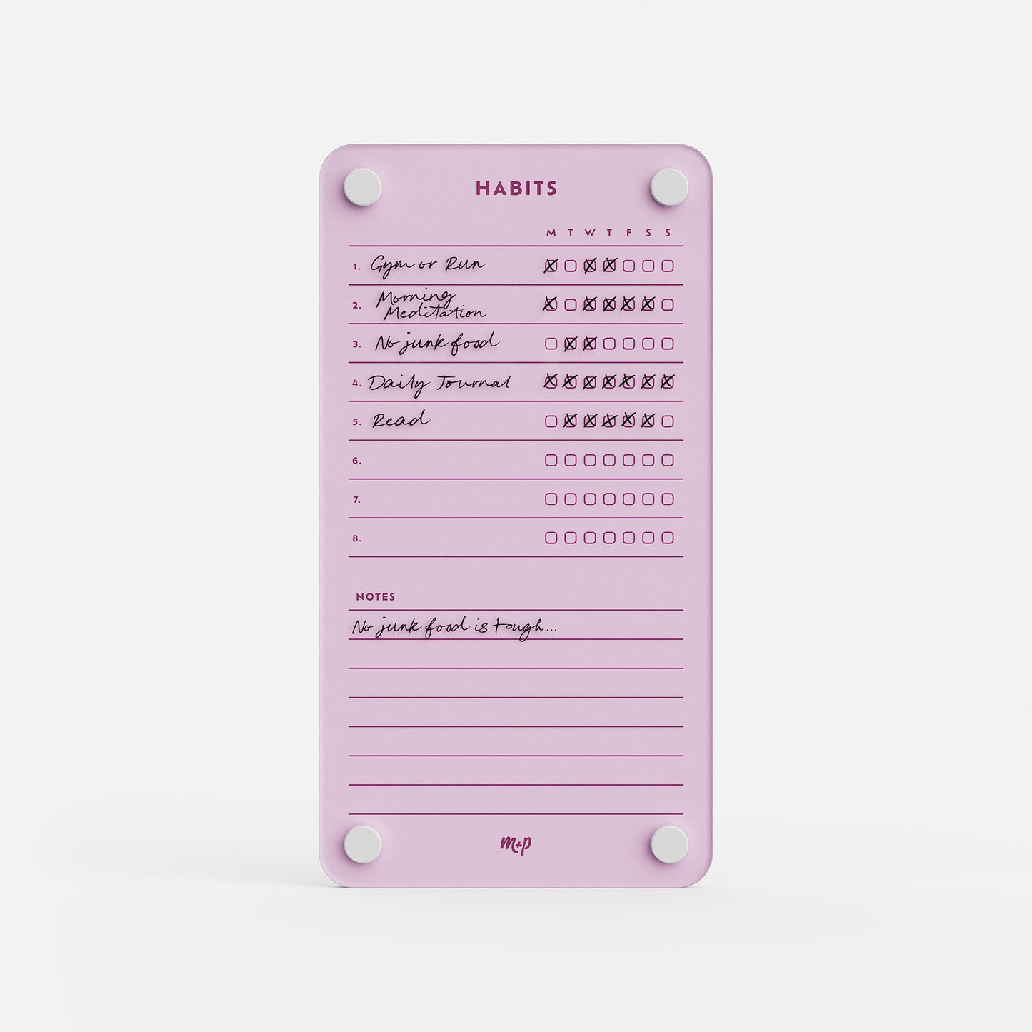 The Weekly Habits 59 is a pink habit tracker board with white magnets for daily goals like “Gym or Run,” “Morning Meditation,” and “Read,” plus a notes section—a stylish way to stay motivated and organized each day.