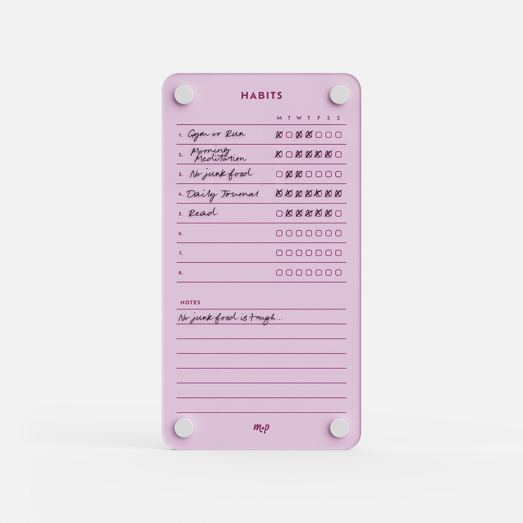 The Weekly Habits 59 is a pink habit tracker board with white magnets for daily goals like “Gym or Run,” “Morning Meditation,” and “Read,” plus a notes section—a stylish way to stay motivated and organized each day.