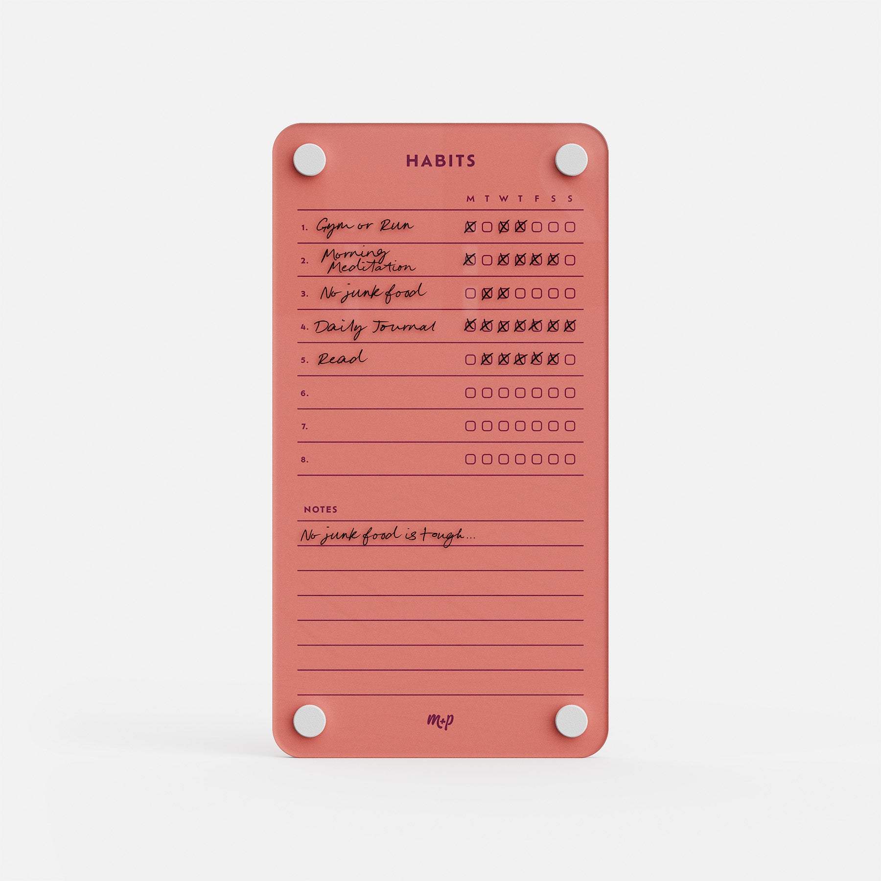 The Weekly Habits 59 is a pink habit tracker for monitoring six daily habits, with weekday checkboxes (some checked) and notes like "No junk food is tough." Four white magnets keep the board securely in place.