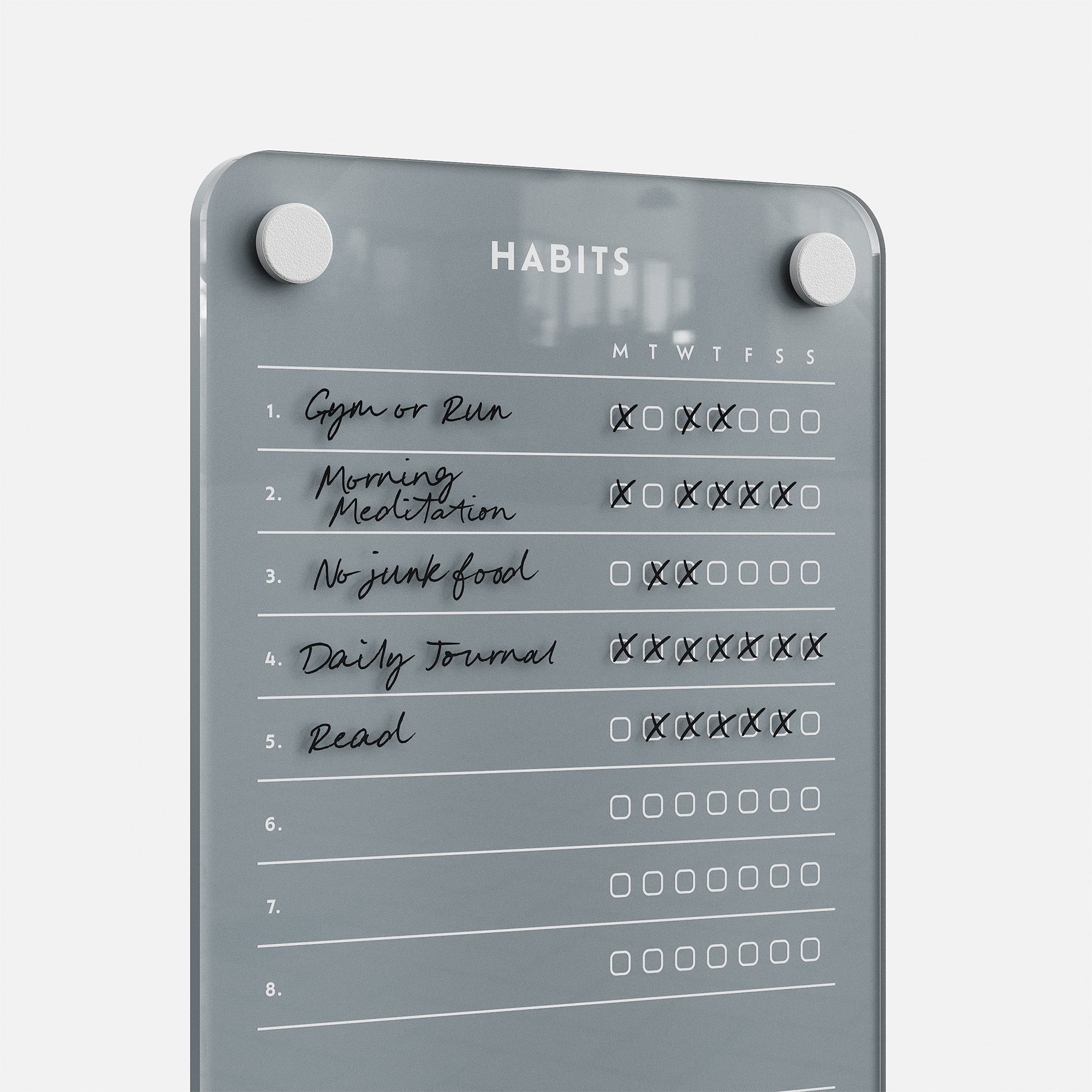 Weekly Habits 59 is a gray glass goal board listing daily habits—like Gym, Morning Meditation, No Junk Food, Daily Journal, and Read—with checkboxes for each day of the week. Some are ticked, making it a sleek and motivating habit tracker.