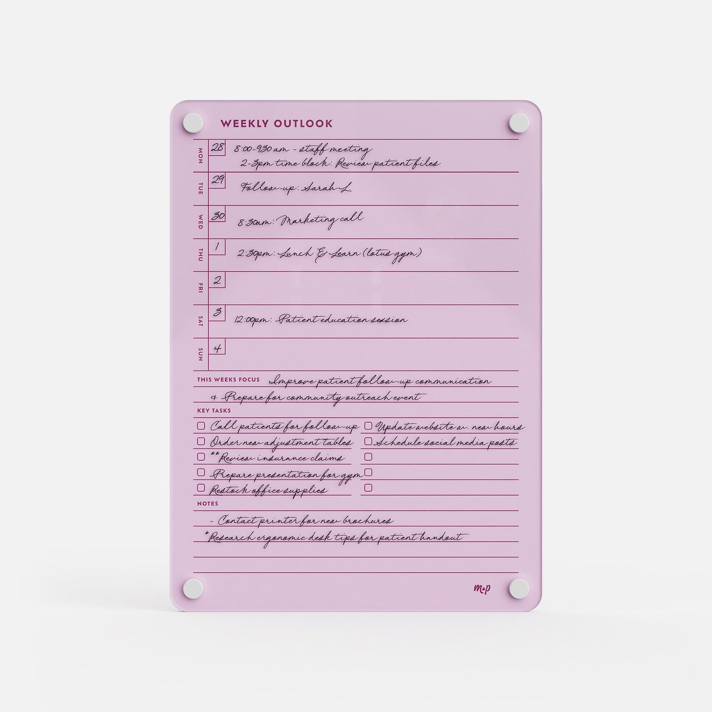 The Weekly Outlook 811 is a lavender productivity organizer featuring handwritten notes, time slots, and checkboxes for tasks and goals. It’s secured at each corner by four white circular magnets.