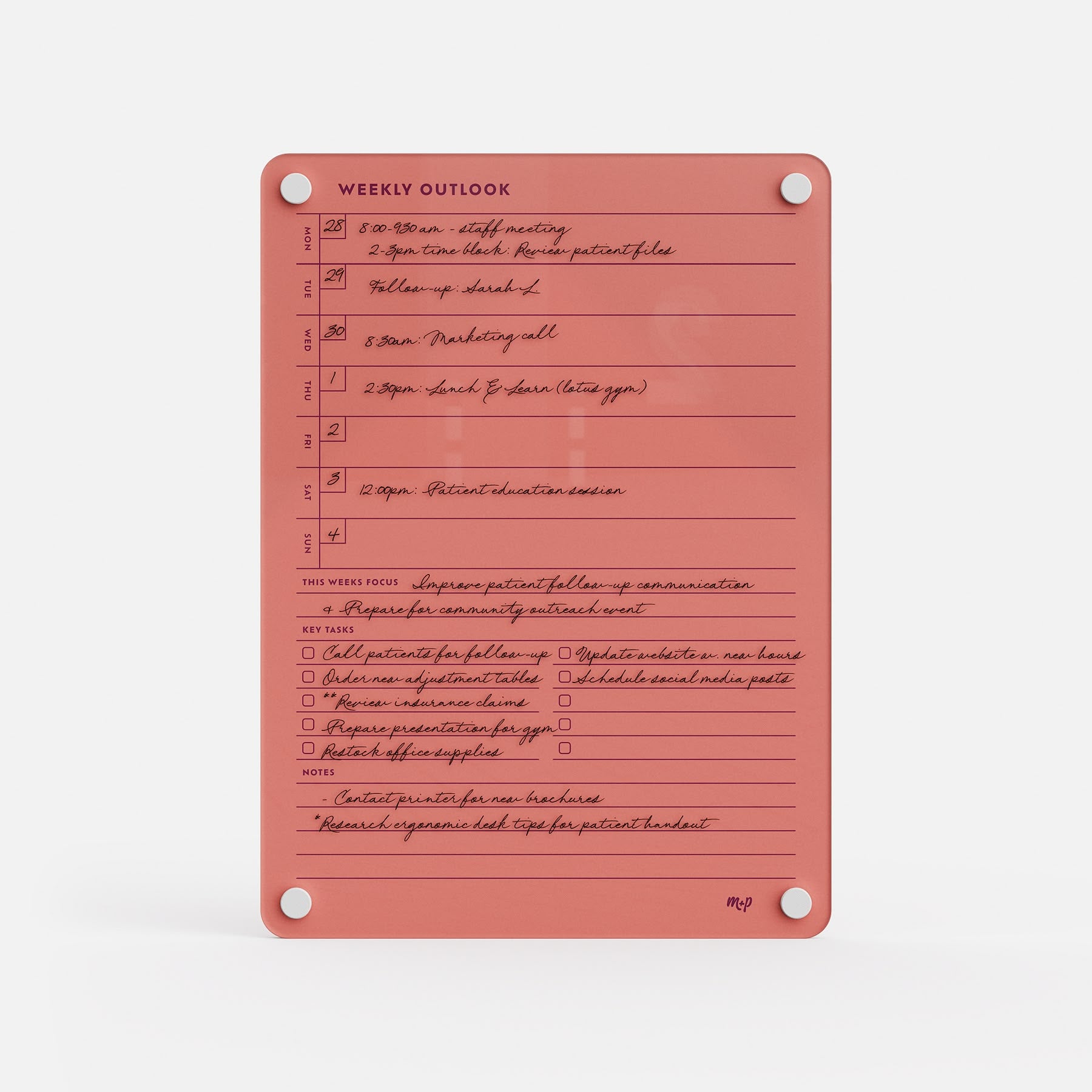 The Weekly Outlook 811 is a coral-colored planner and productivity organizer with handwritten tasks, scheduled times, sections for outlook, goals, notes, completion checkboxes, and silver fasteners securing the corners.