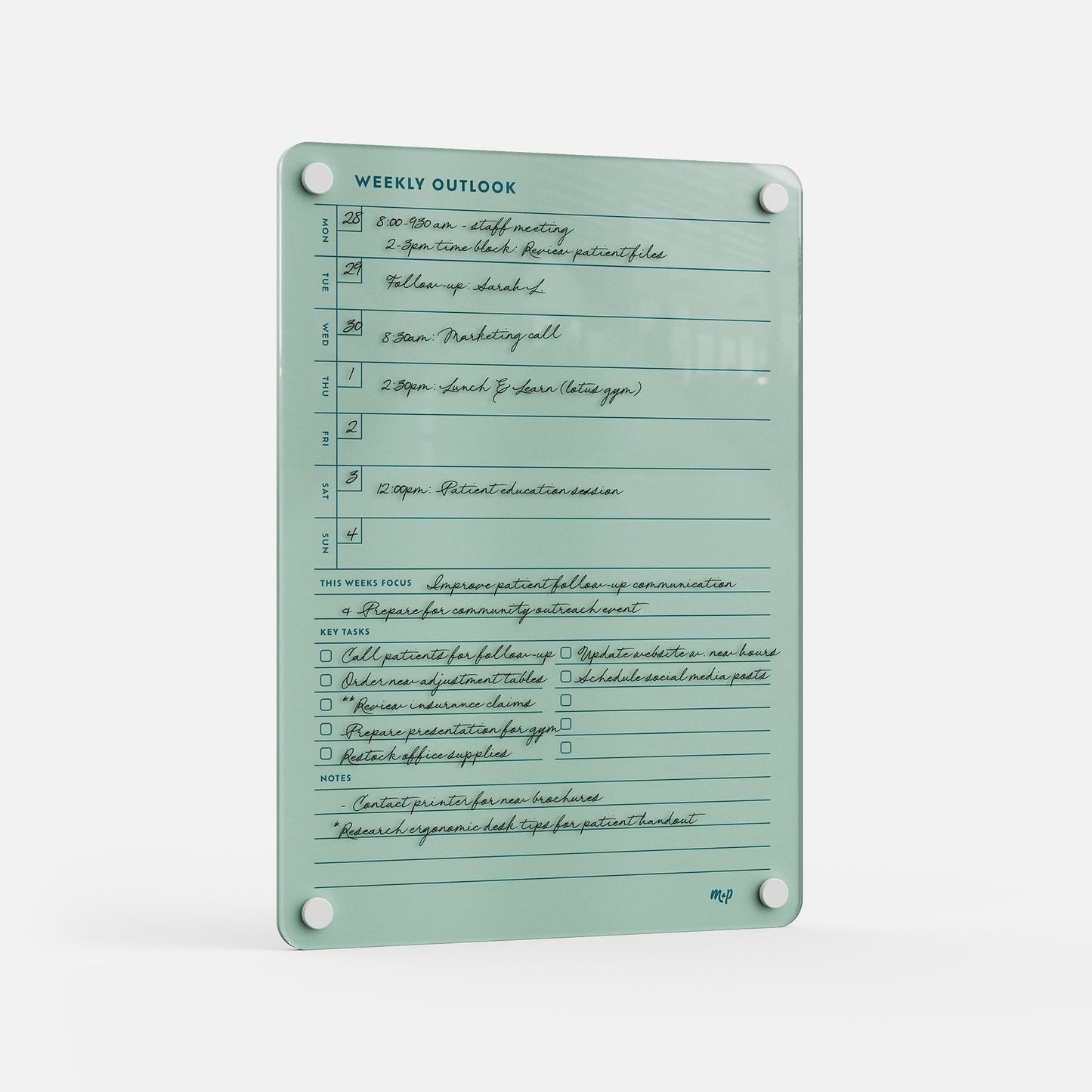 The Weekly Outlook 811 is a mint green planner and productivity organizer with handwritten sections for time slots, weekly focus, key tasks, and notes—mounted via four corner holes on a white background.
