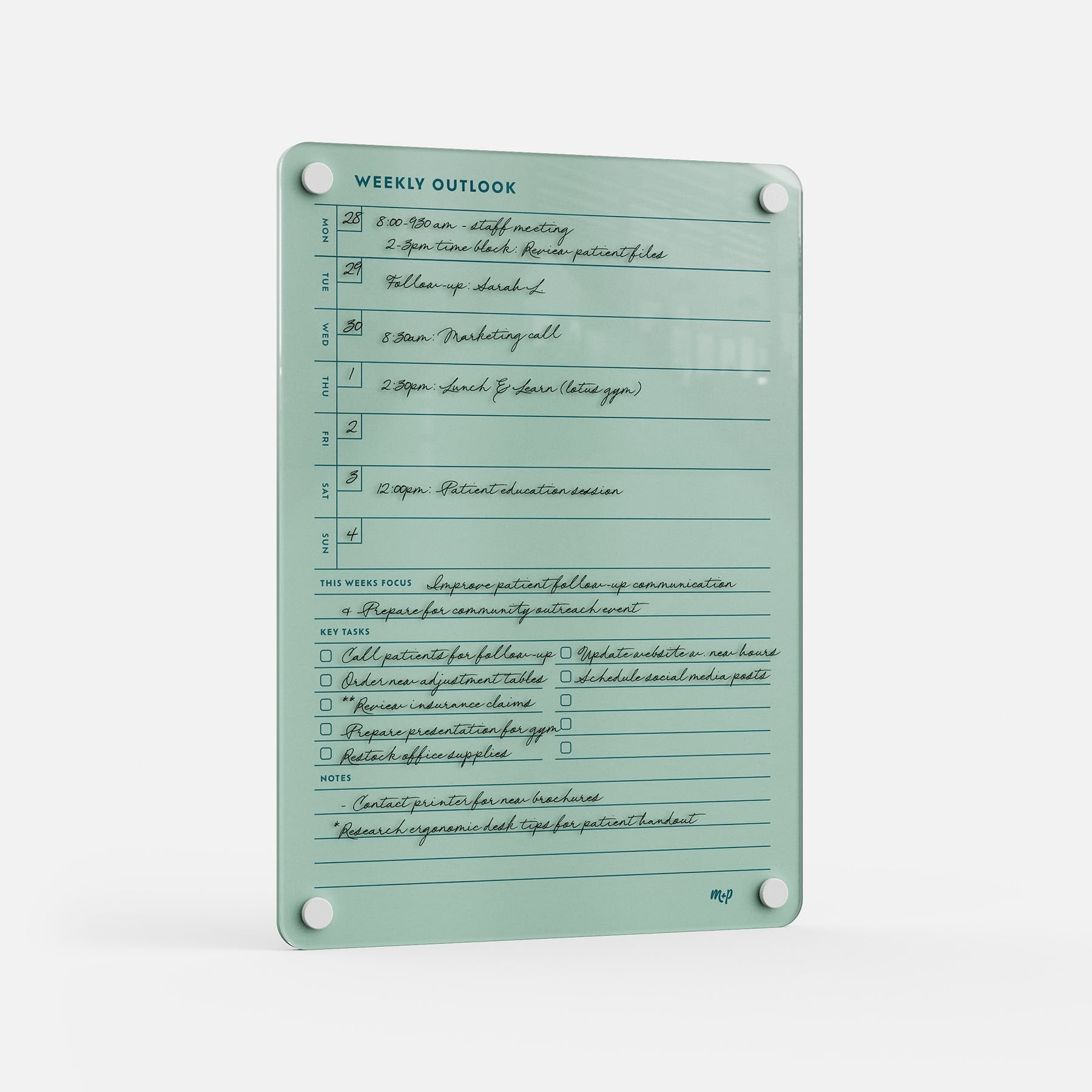 The Weekly Outlook 811 is a mint green planner and productivity organizer with handwritten sections for time slots, weekly focus, key tasks, and notes—mounted via four corner holes on a white background.